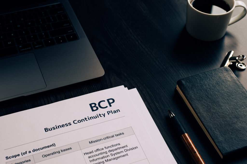 There is dummy documents that created for the photo shoot on the desk about Business Continuity Plan