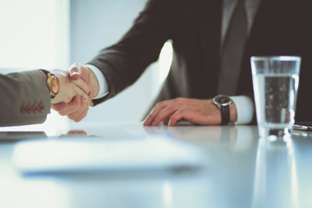 Portrait of businessman giving hand for handshake Portrait of businessman giving hand for handshake